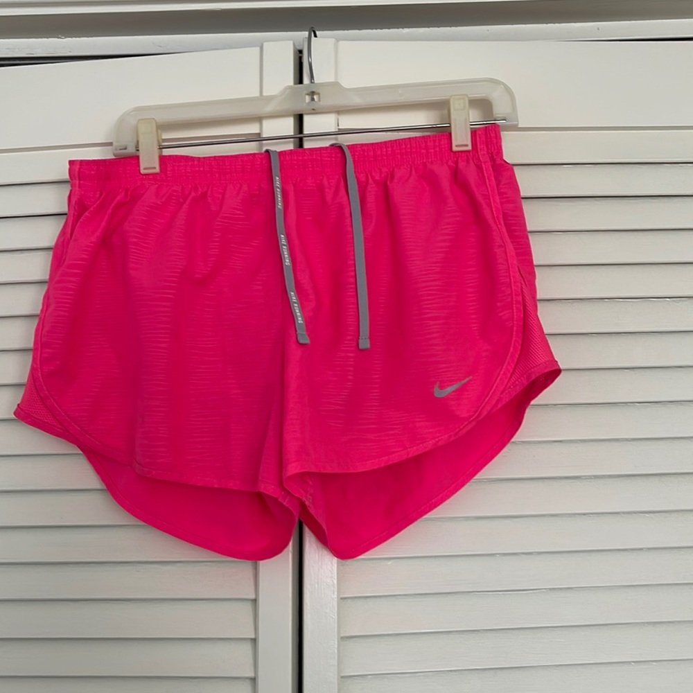 Neon pink Nike athletic shorts